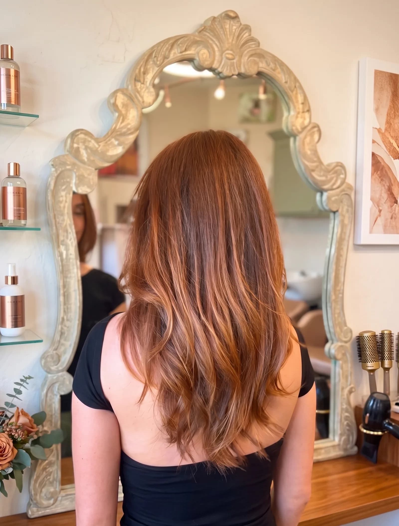 Long healthy auburn hair with soft shiny waves styled at Salon Lola in Gilbert, Arizona