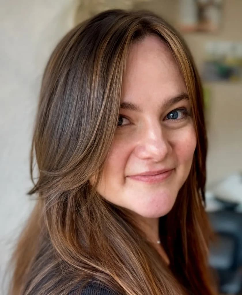 Brunette hair with caramel balayage highlights and face-framing layers at Salon Lola in Gilbert, Arizona