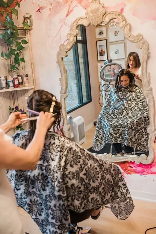 Marilo welcoming a client at Salon Lola
