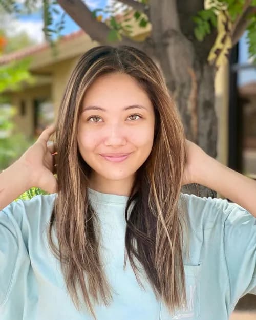 Long layered hair with sun-kissed balayage