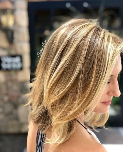 Blonde balayage lob with beach waves